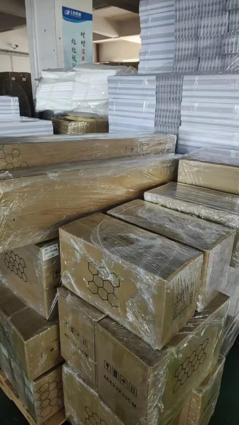 Packed LUXBONTOP lighting orders stacked and ready for dispatch