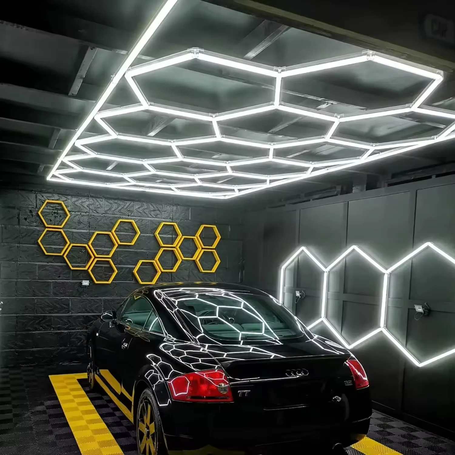 Amber and white geometric LED wall lighting beside a black car