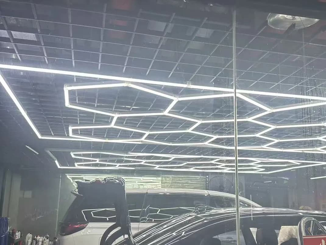Framed hexagon garage lights installed in a car detailing shop, 6500K LED ceiling grid