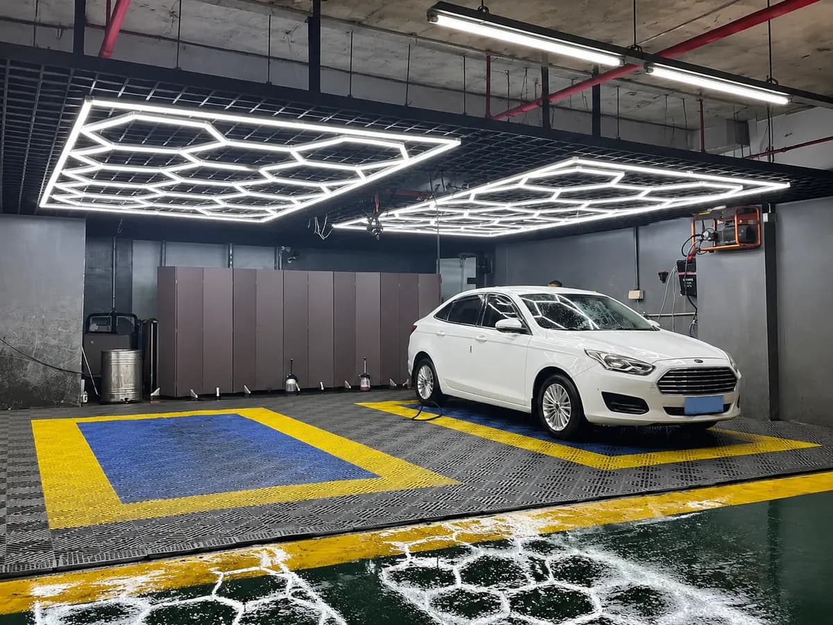 Two framed hexagon garage light kits installed above a car wash and detailing bay