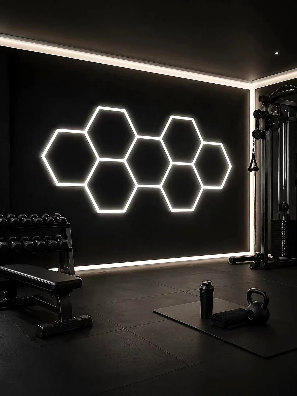 Seven-hexagon white LED wall cluster in a home gym