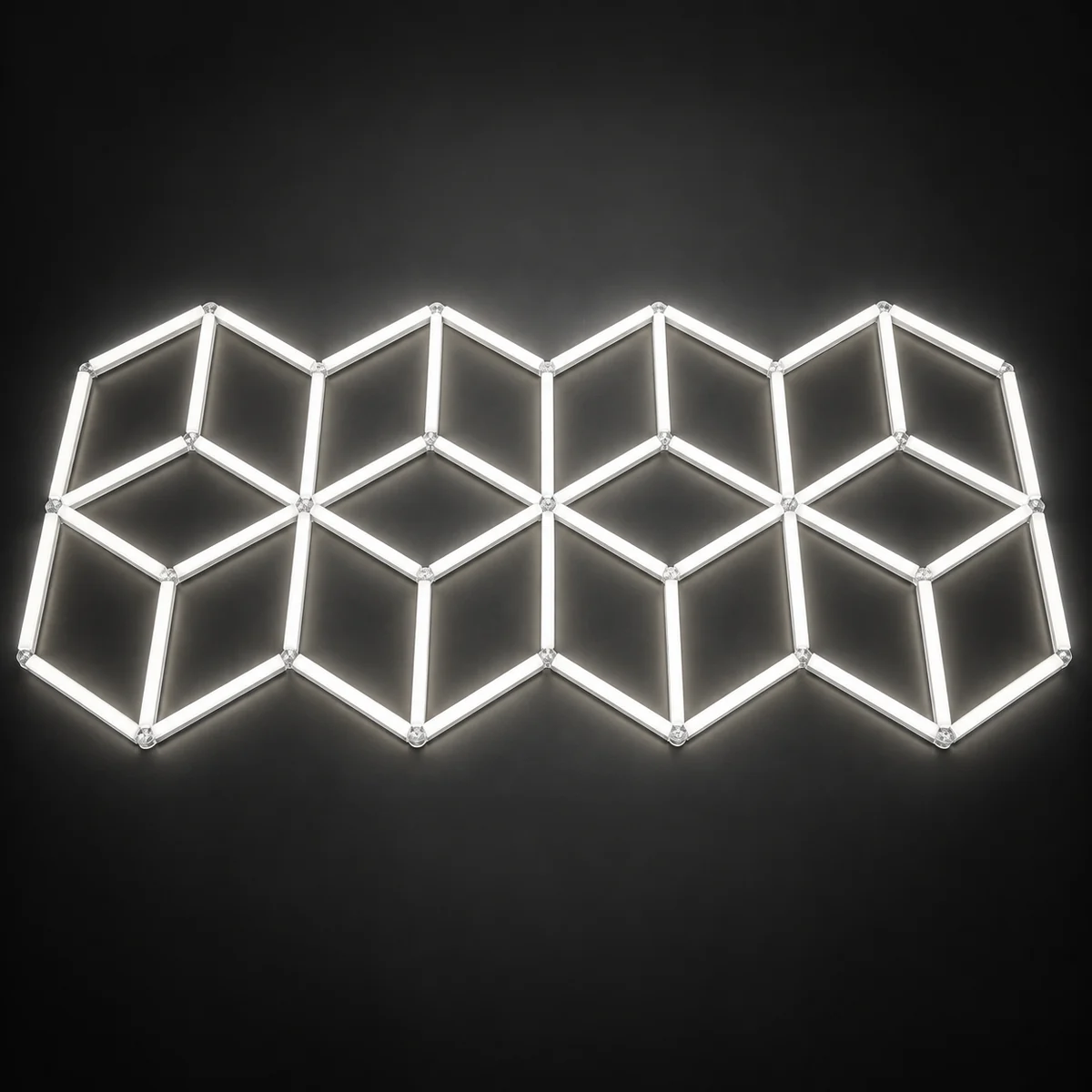 Row of interlocking cube-pattern lighting cells in white light