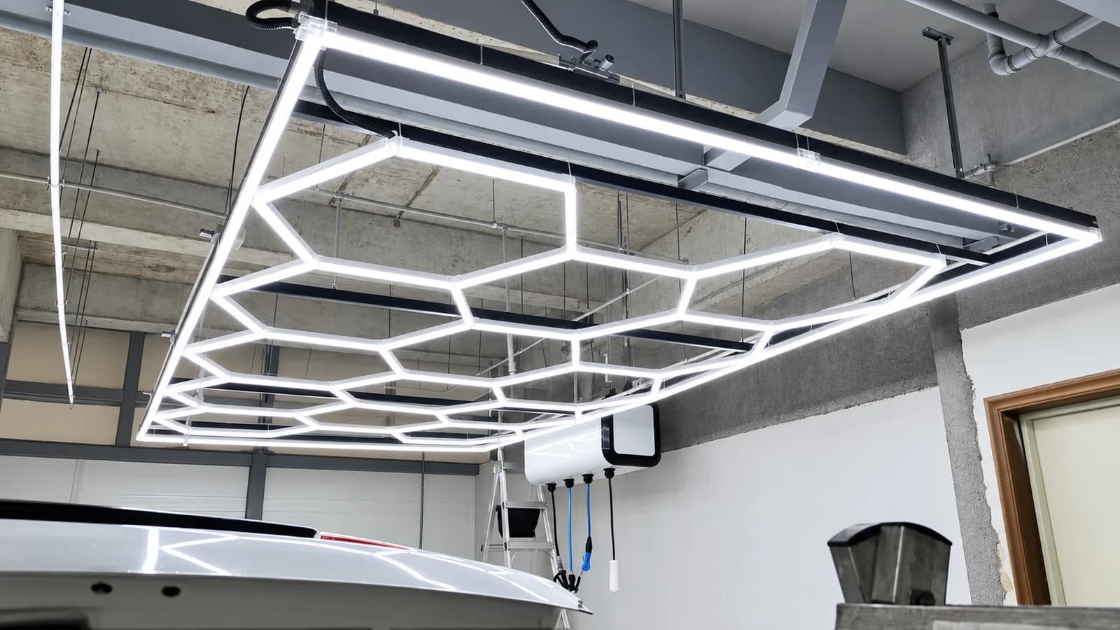 Rectangular framed honeycomb LED ceiling installed above a work area