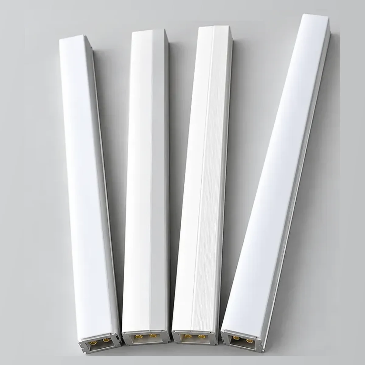 Four LUXBONTOP aluminum and PC lighting profiles with visible end contacts